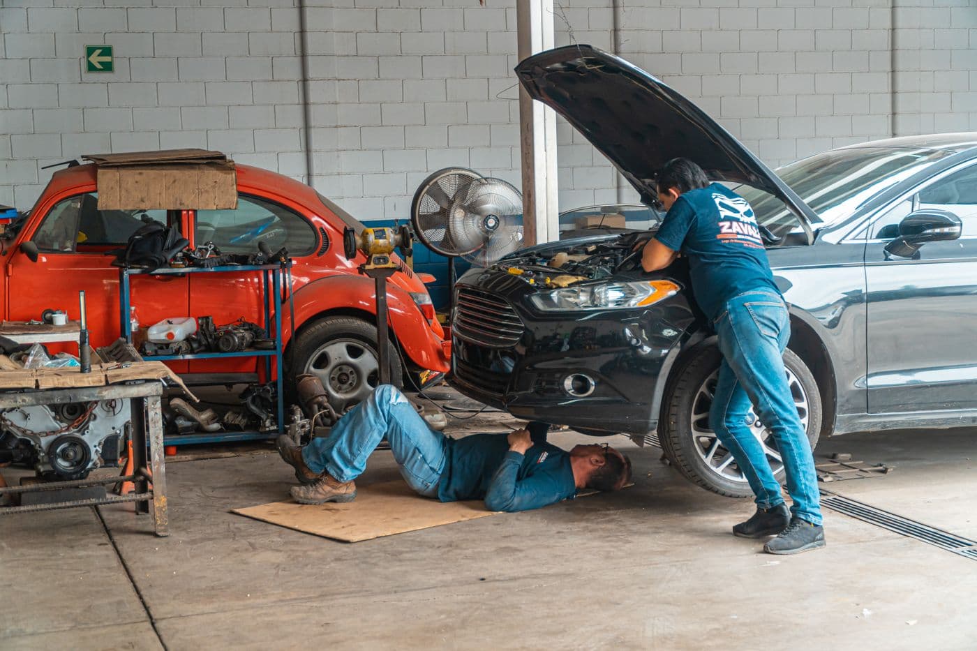 People working around a vehicle