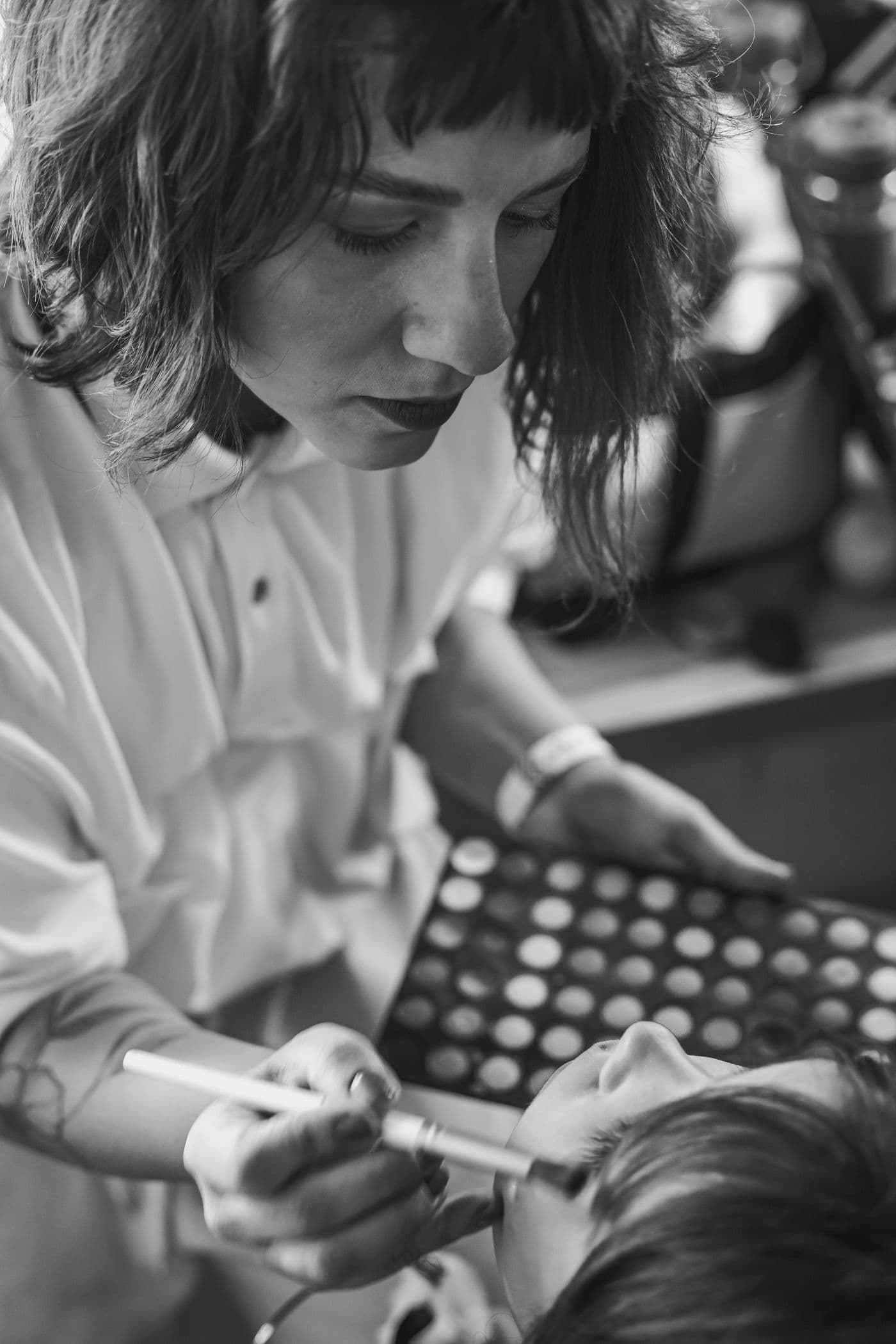 Professional makeup application during a styling session