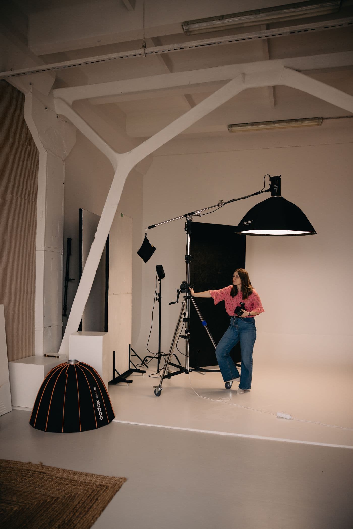 Photographer working with studio equipment