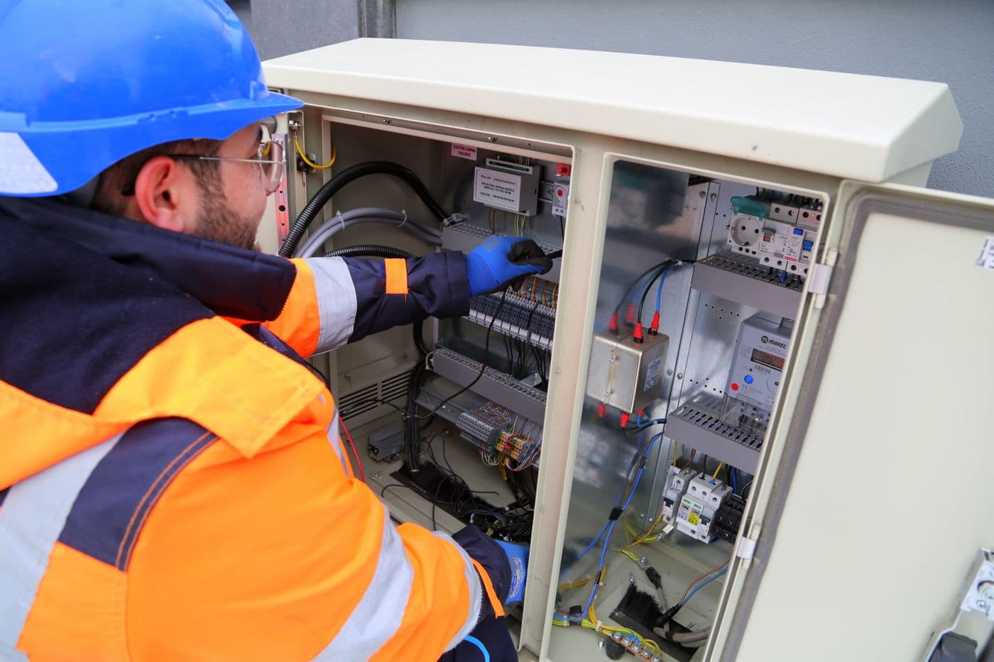 Electrical technician working on a control panel